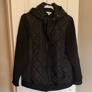 Black jacket with zipper front.